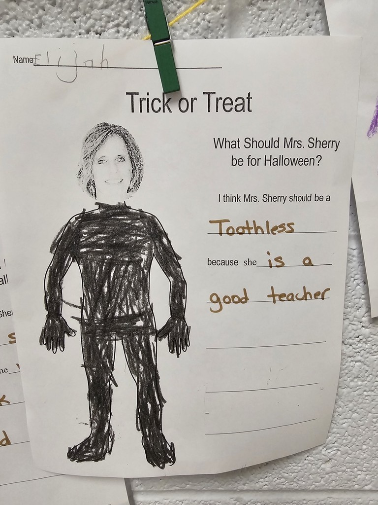 teacher dressed in costume created by kindergarten student