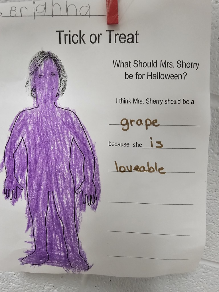 teacher dressed in costume created by kindergarten student