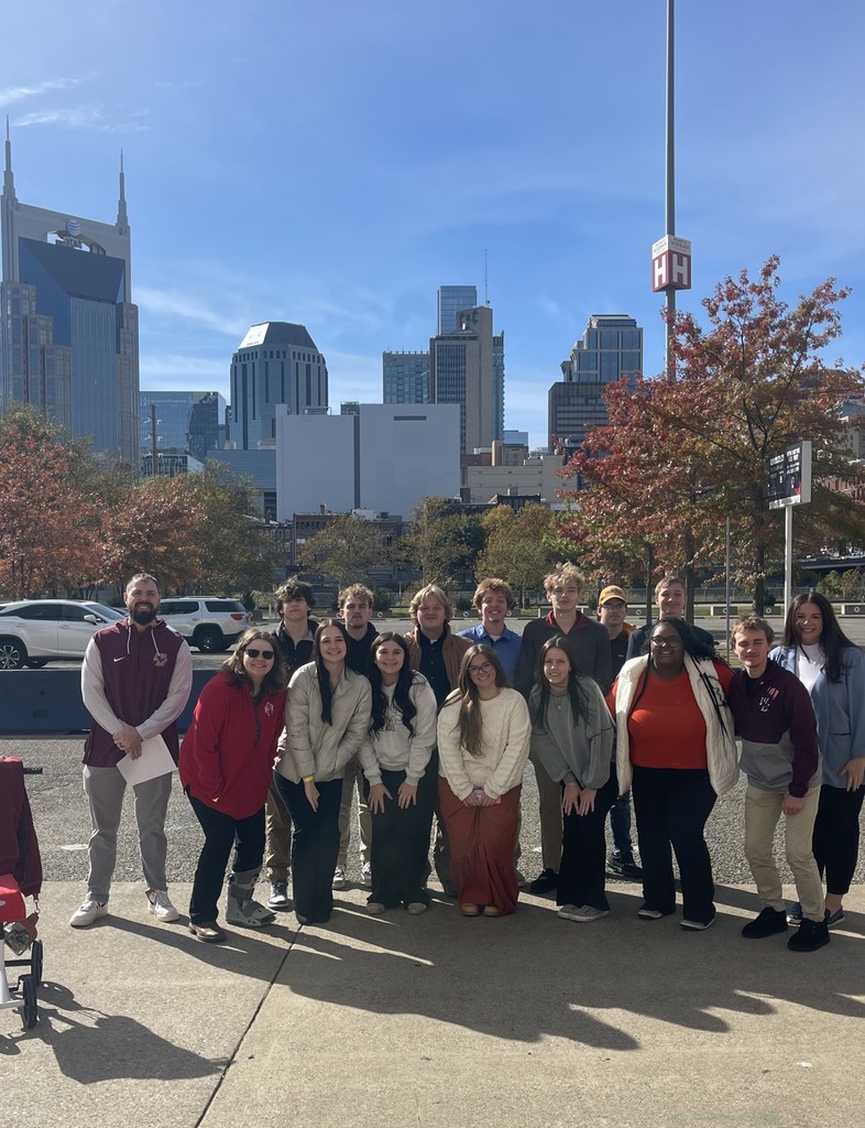 West Carroll FBLA students pose in front of downtown Nashville, TN