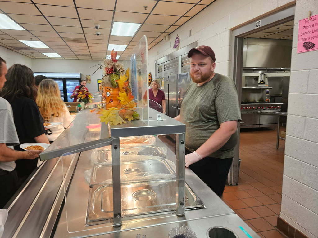 WCHS principal, Adam Douglas, serving spaghetti at the West Carroll Community Spaghetti Dinner