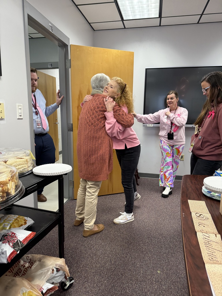 Mrs. Linda Hatfield pictured hugging longtime friend and coworker, Mrs. Michelle Tolley. Also pictured are Adam Douglas, Tammy Davis, and Macy Cunningham 