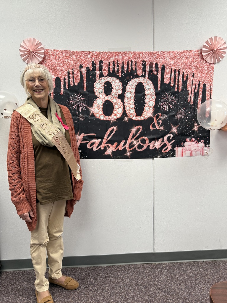 Mrs. Linda Hatfield pictured with 80th birthday decorations 