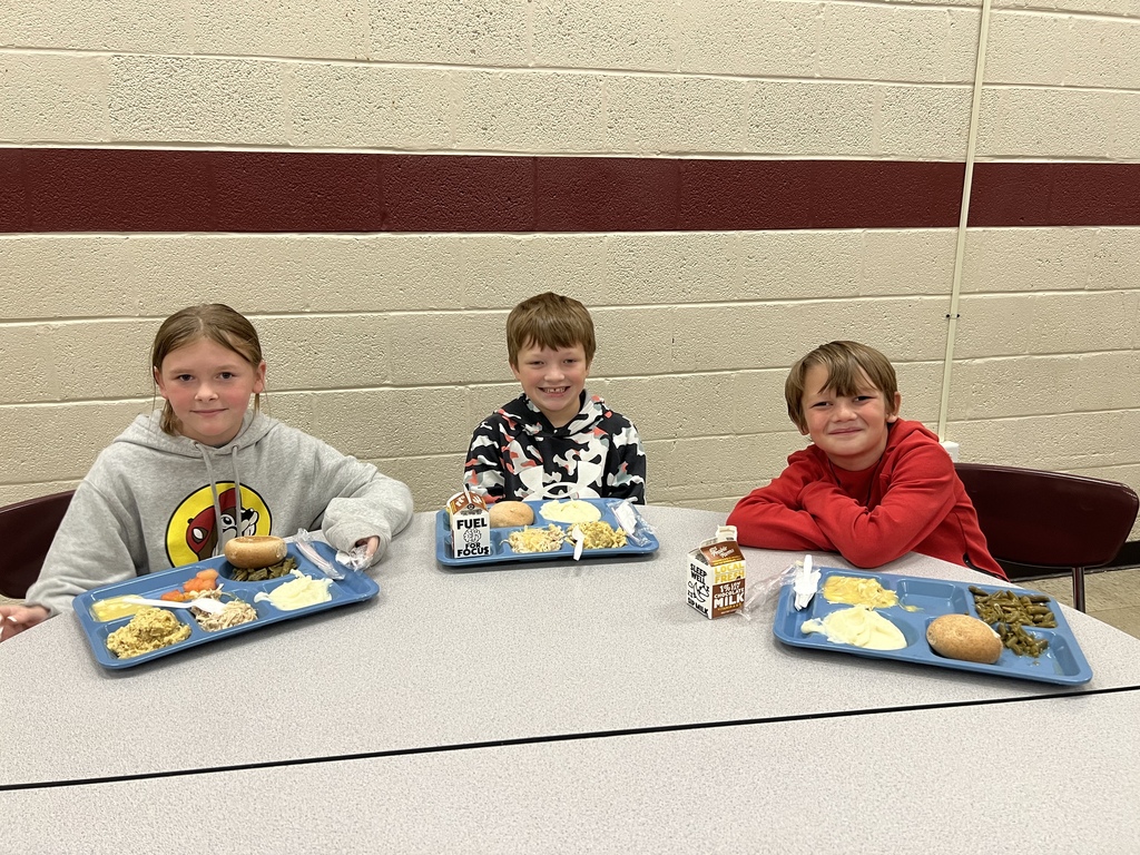 West Carroll Elementary School students enjoying a Thanksgiving meal. 