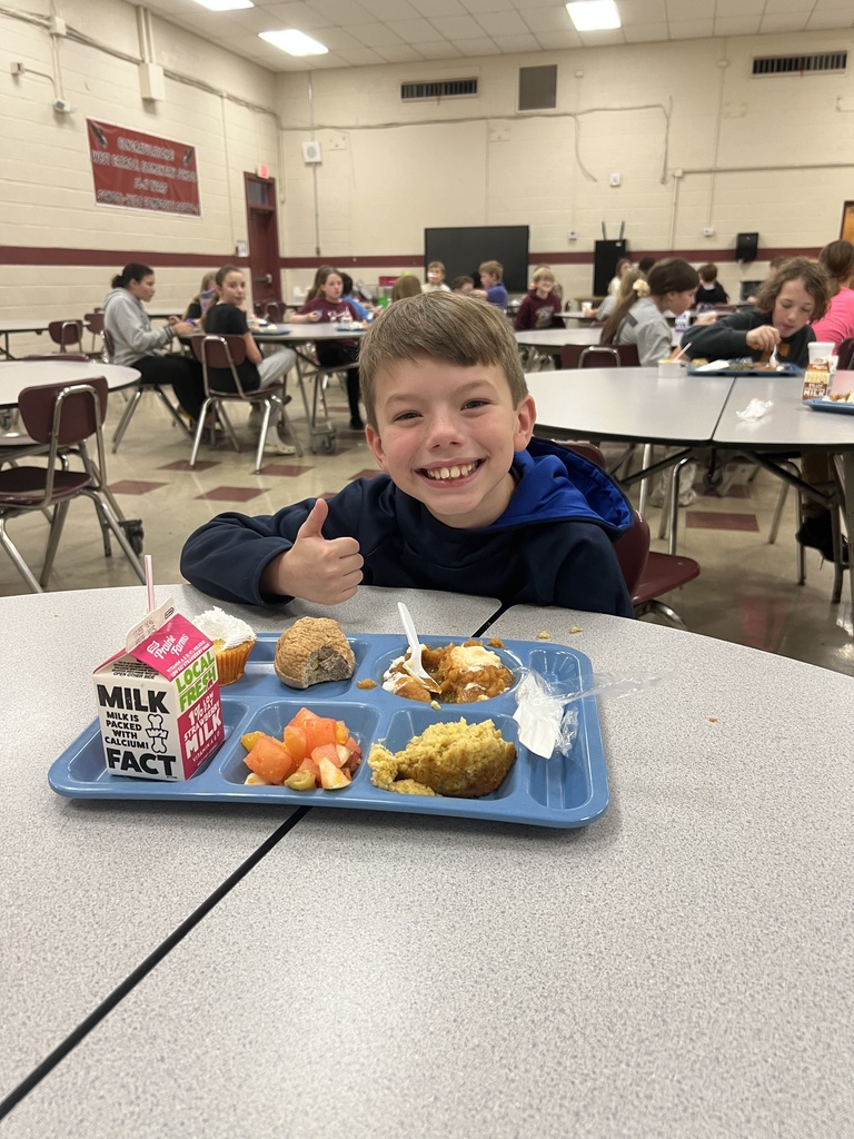 West Carroll Elementary School student enjoying a Thanksgiving meal. 