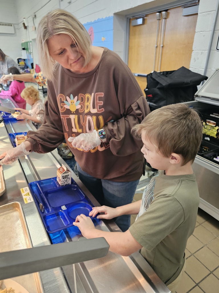 West Carroll Primary School student enjoying a Thanksgiving meal. 