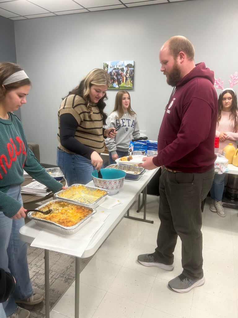 Staff being served breakfast by SGA members