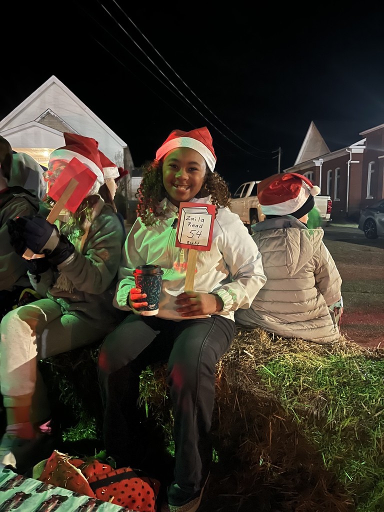 wces student zaila  in town parade after reading 50+ books since august 