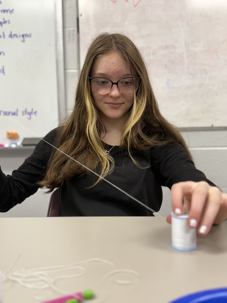 Up close shot of high school student working on hand sewing project for Human Studies course