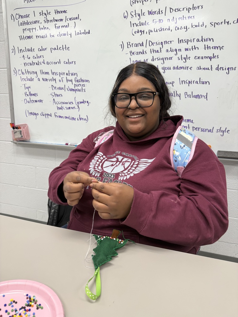 Up close shot of high school student working on hand sewing project for Human Studies course