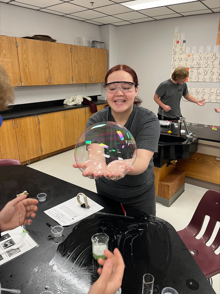 Chemistry students experimenting with bubbles.
