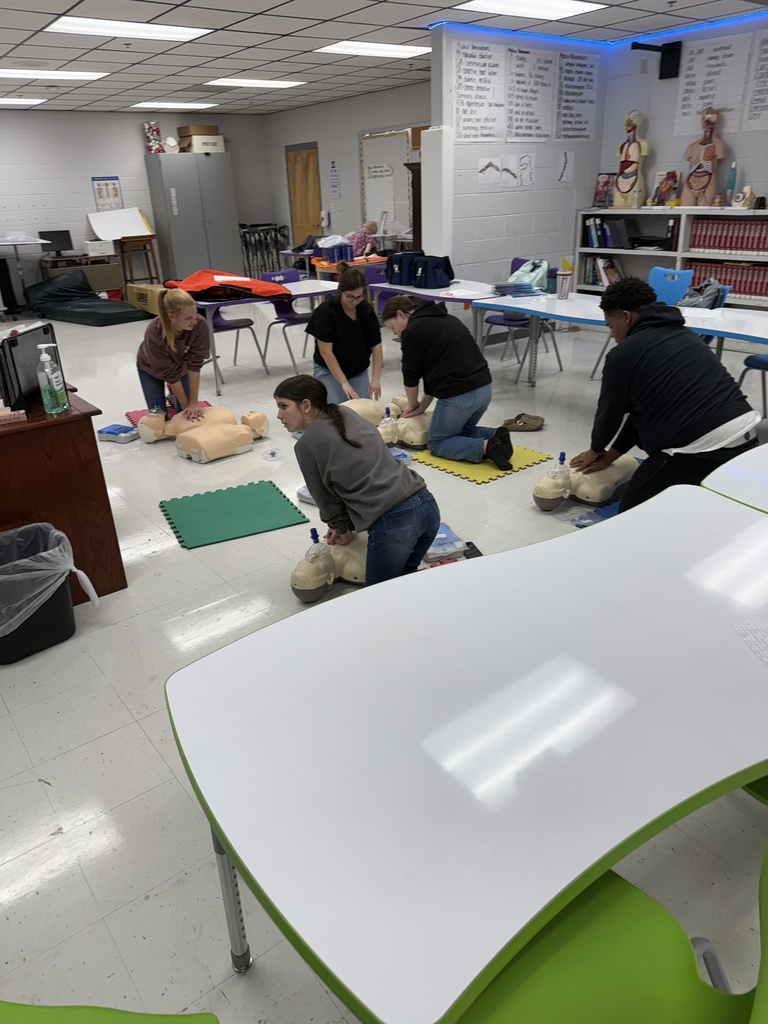 Health science students getting CPR certified in class. 