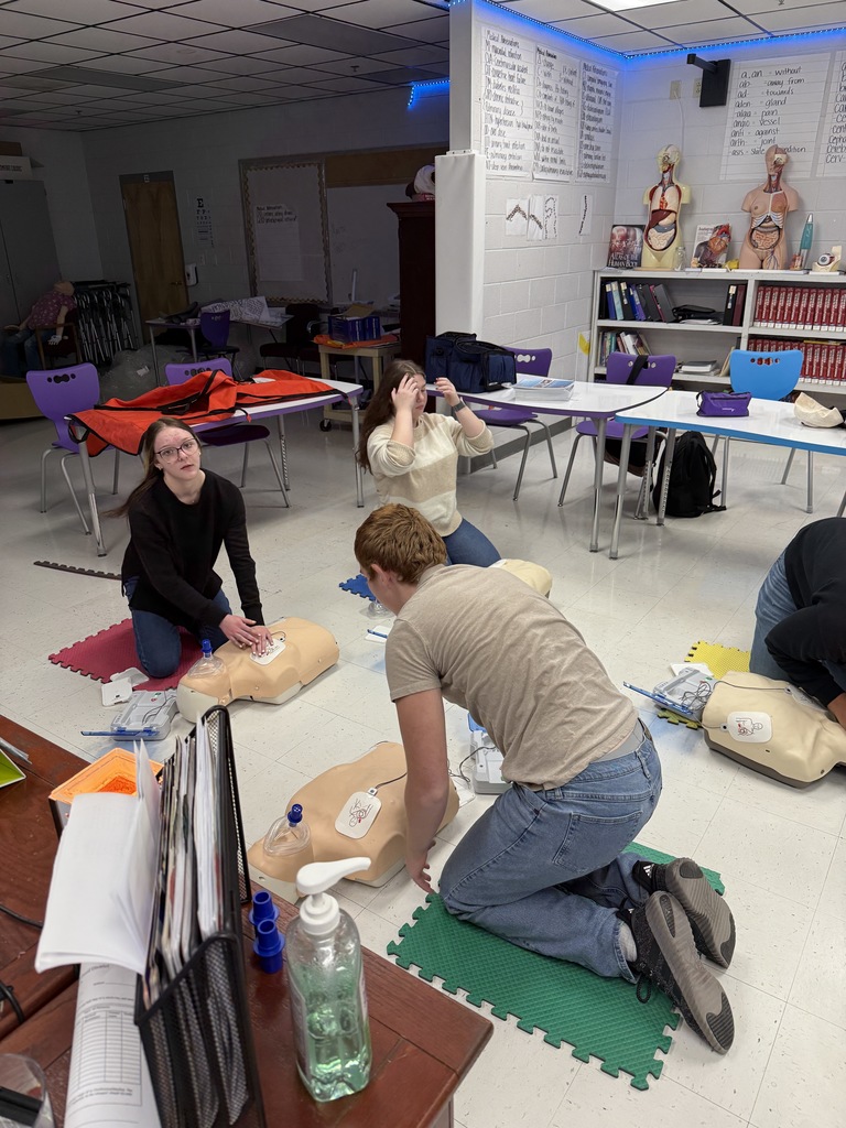 Health science students getting CPR certified in class. 