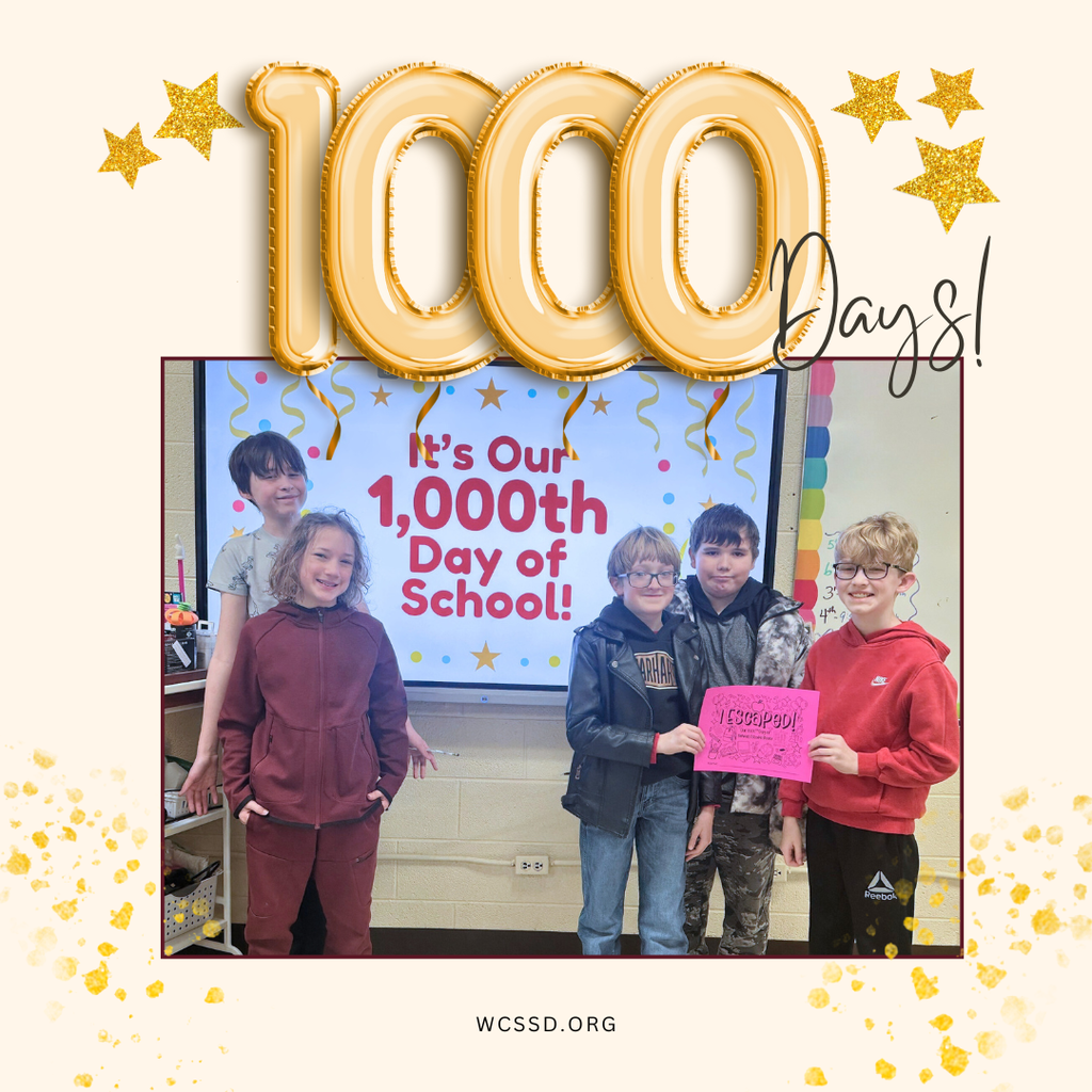 1000 days of school for 5th grade with students standing before banner