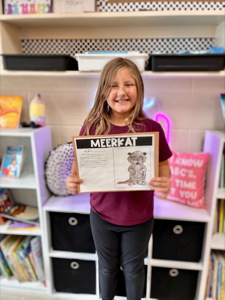 3rd grade animal adaptation projects with students displaying work