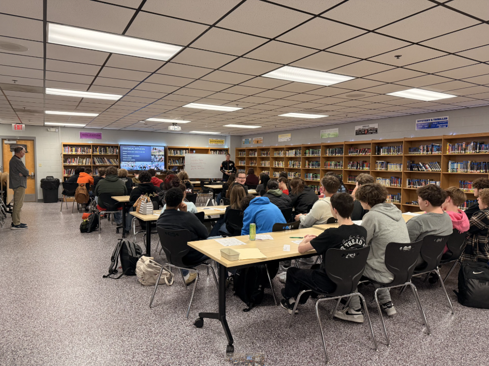 United States Marine speaking to juniors about military opportunities after high school