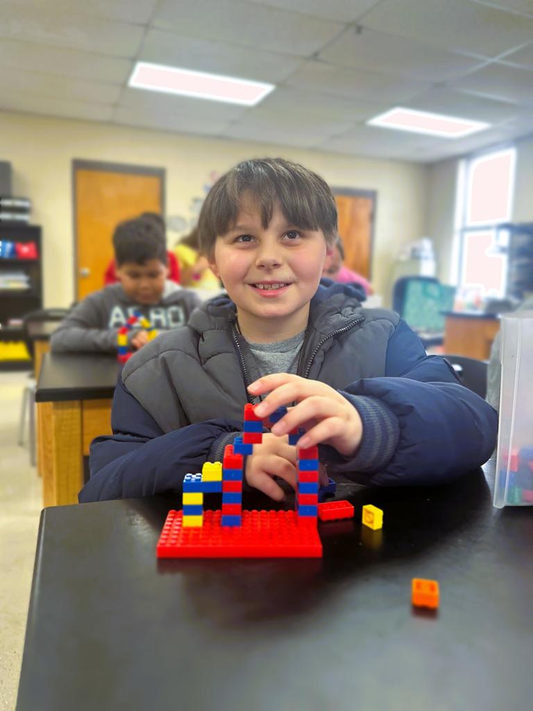 wces 3rd graders building with legos showing their lego creation based on medieval building structures