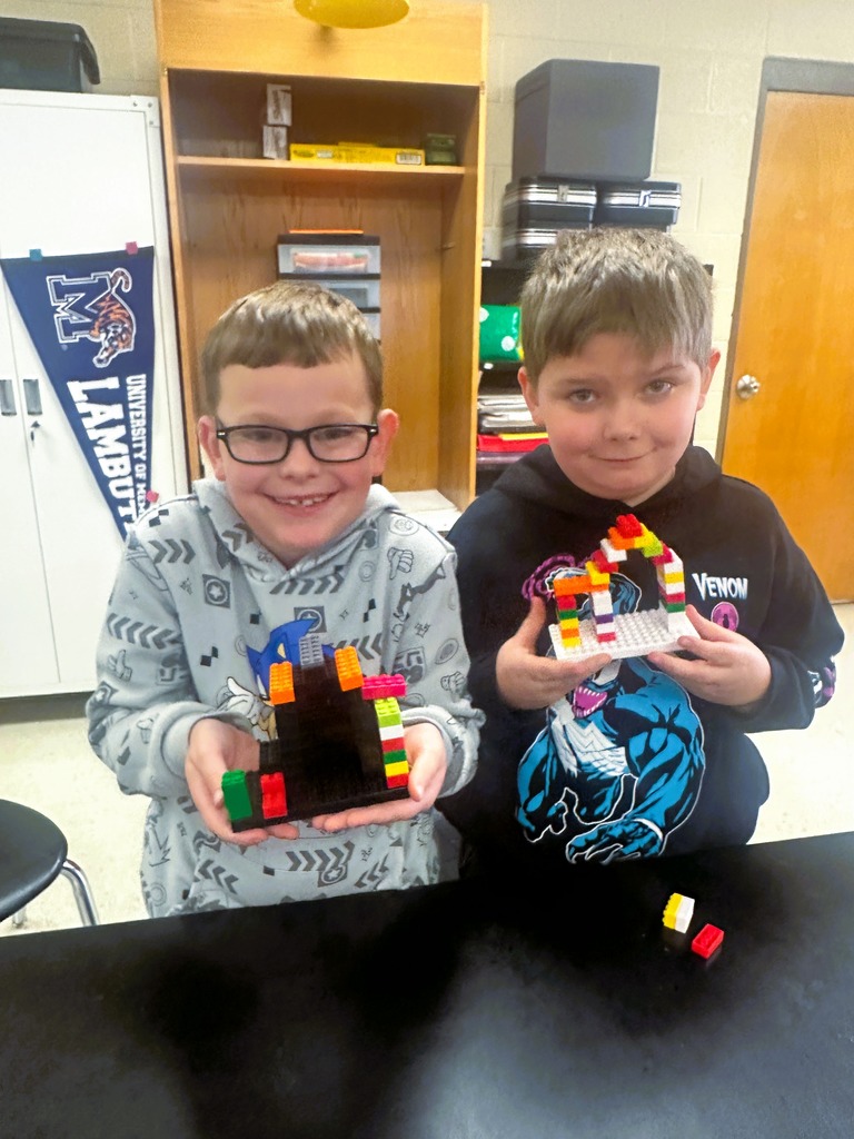 wces 3rd graders building with legos showing their lego creation based on medieval building structures