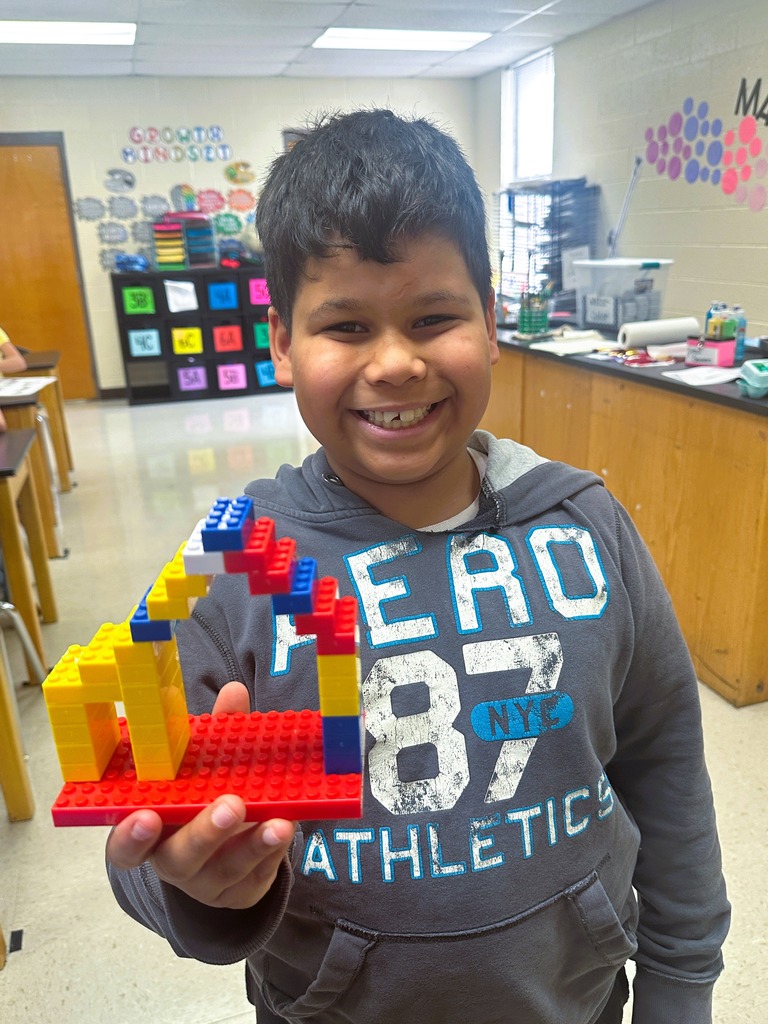 wces 3rd graders building with legos showing their lego creation based on medieval building structures