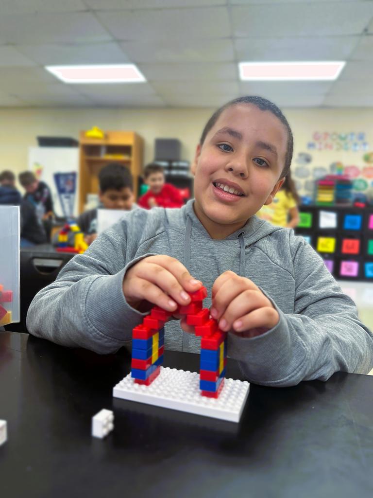 wces 3rd graders building with legos showing their lego creation based on medieval building structures