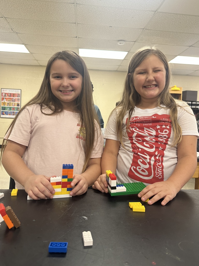 wces 3rd graders building with legos showing their lego creation based on medieval building structures