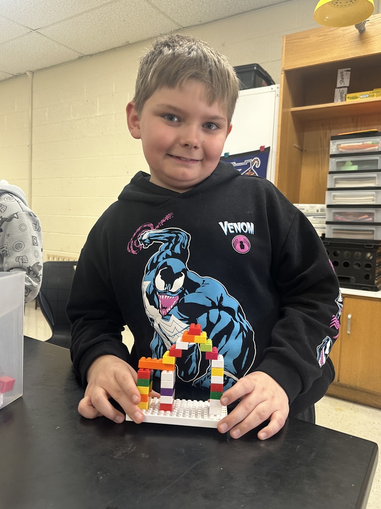 wces 3rd graders building with legos showing their lego creation based on medieval building structures