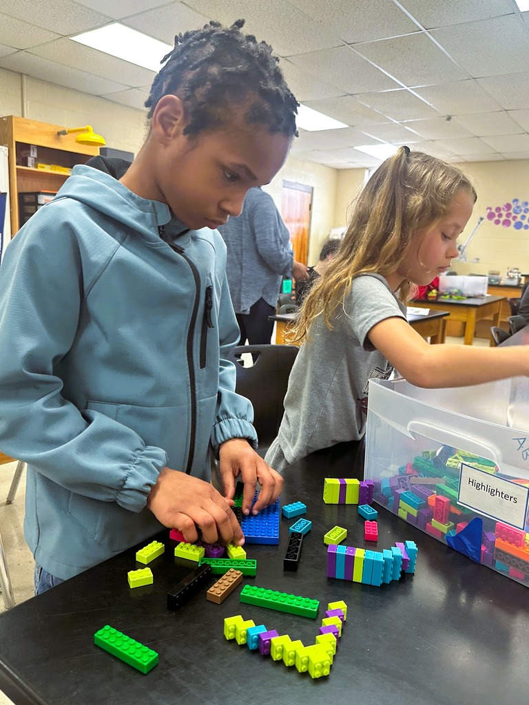 wces 3rd graders building with legos showing their lego creation based on medieval building structures
