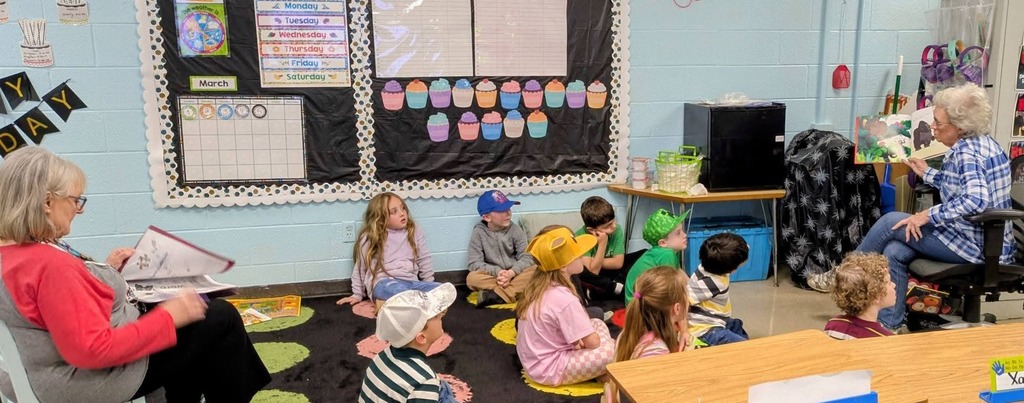 West Carroll Primary students listen as a guest speaker reads to them during Read Across America week