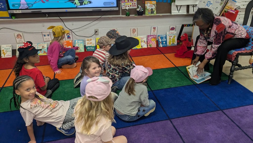 West Carroll Primary students listen as a guest speaker reads to them during Read Across America week