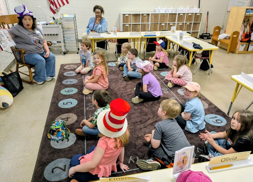 West Carroll Primary students listen as a guest speaker reads to them during Read Across America week