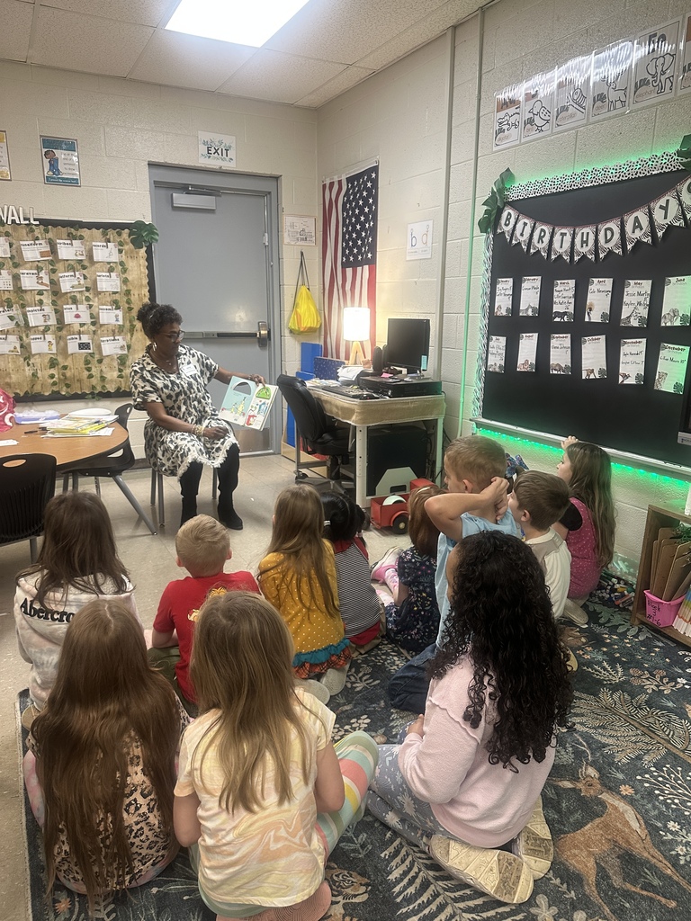 West Carroll Primary students listen as a guest speaker reads to them during Read Across America week