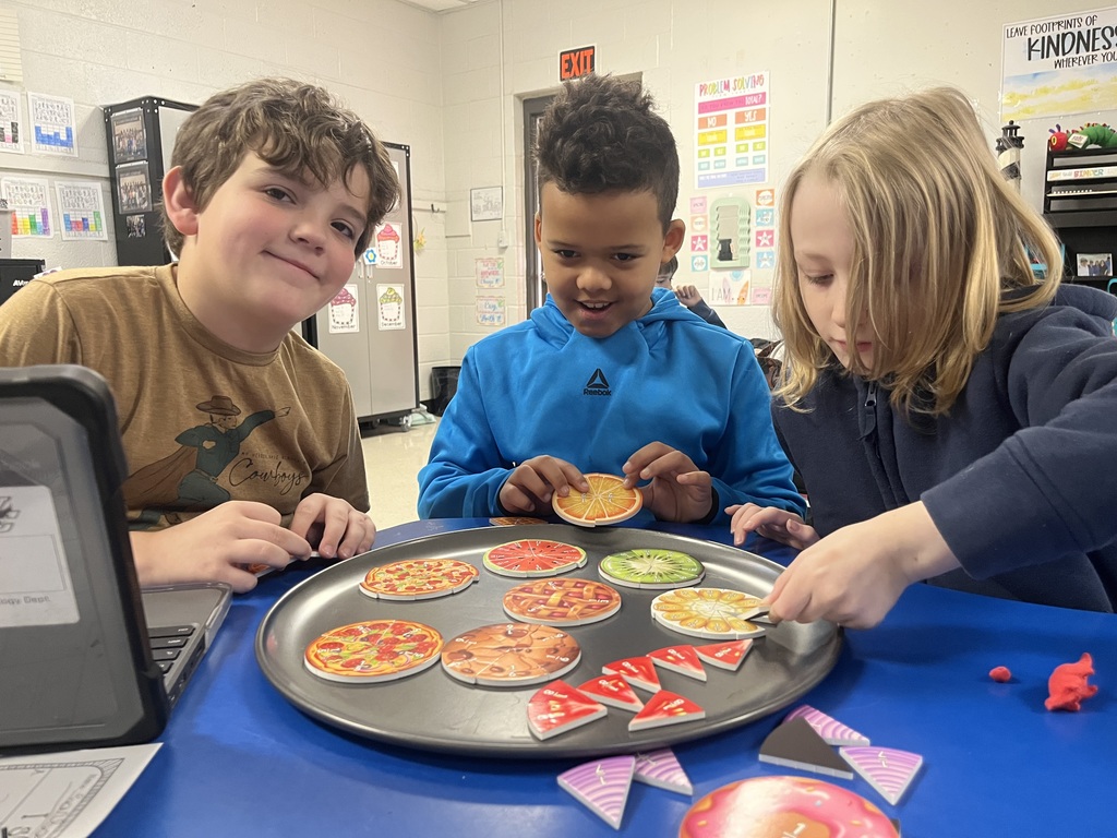 west carroll elementary students working as a fraction detective in Mrs. Lisa's math class