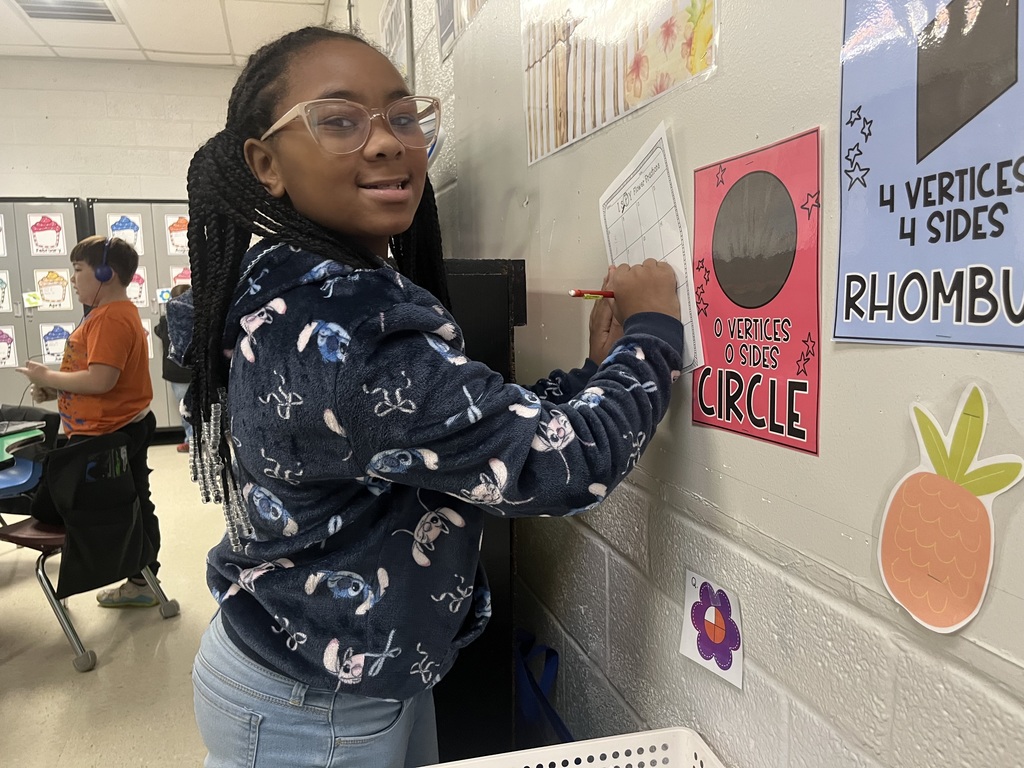 west carroll elementary student working as a fraction detective in Mrs. Lisa's math class