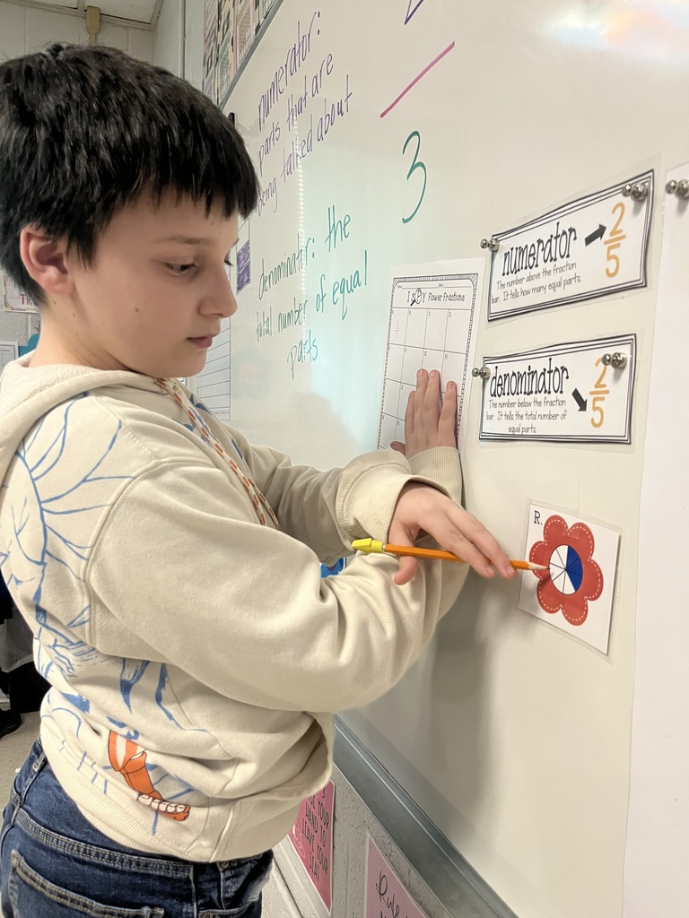west carroll elementary student working as a fraction detective in Mrs. Lisa's math class