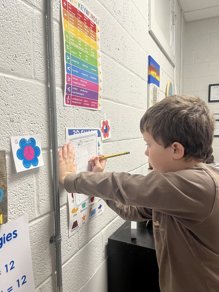 west carroll elementary student working as a fraction detective in Mrs. Lisa's math class
