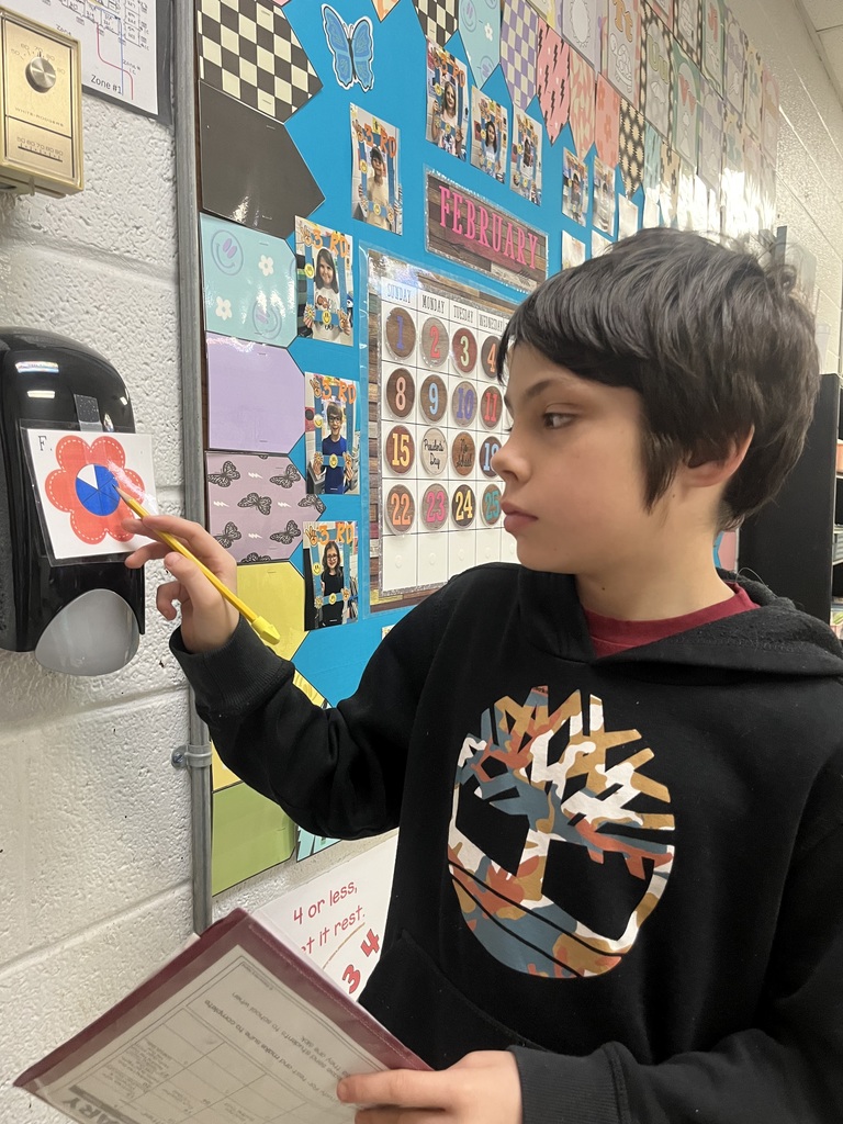 west carroll elementary student working as a fraction detective in Mrs. Lisa's math class