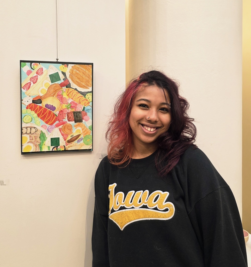 Tyanna McClain pictured with her artwork 