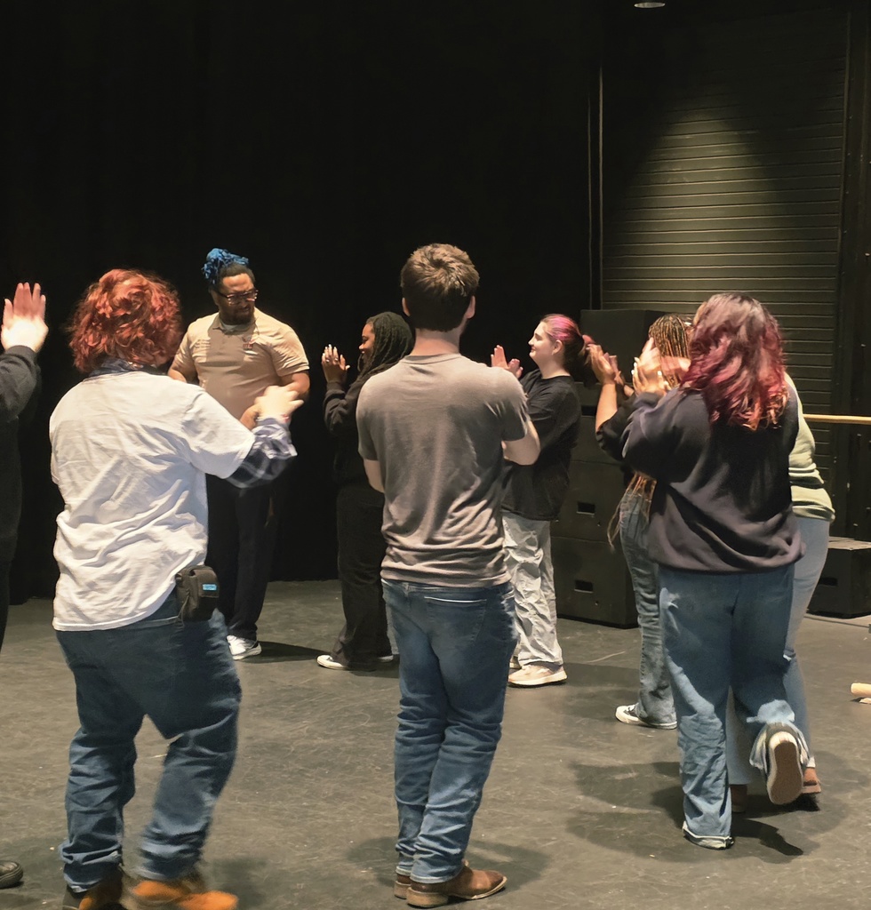 Students participating in team building activities with hullahoops