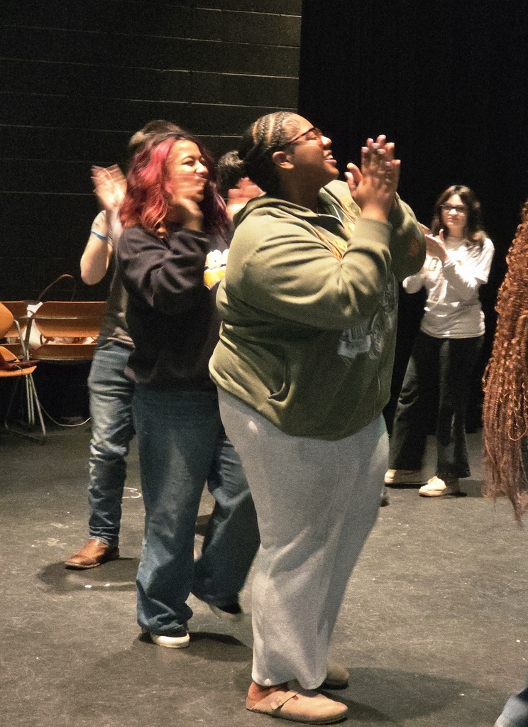 Students participating in team building activities with hullahoops