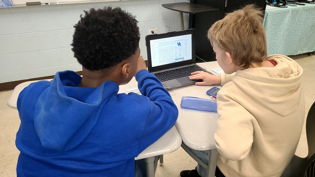 wces students working on march madness math challenges in classroom