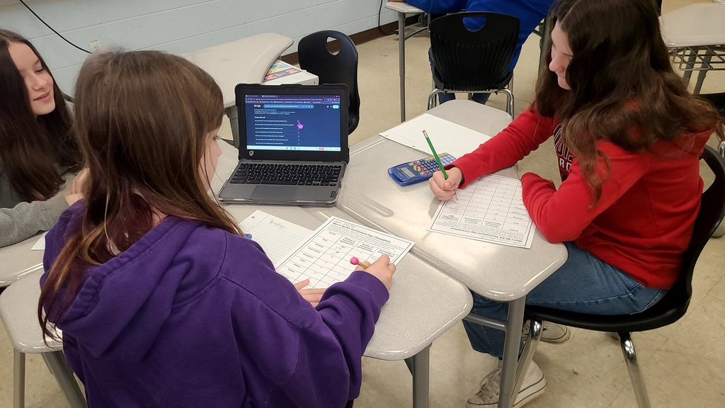 wces students working on march madness math challenges in classroom