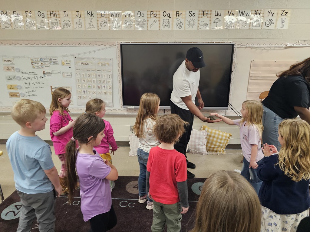 ms taolers class learning about turtle student holding turtle