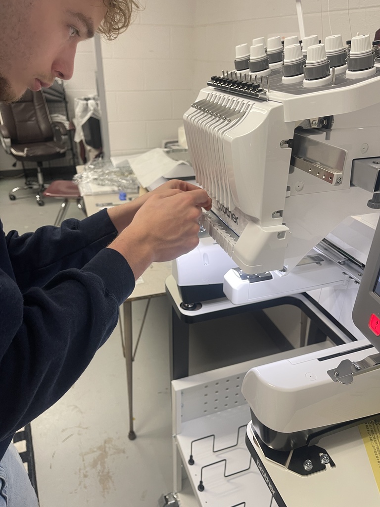 wchs students with new embroidery sewing machine for fbla spirit store project