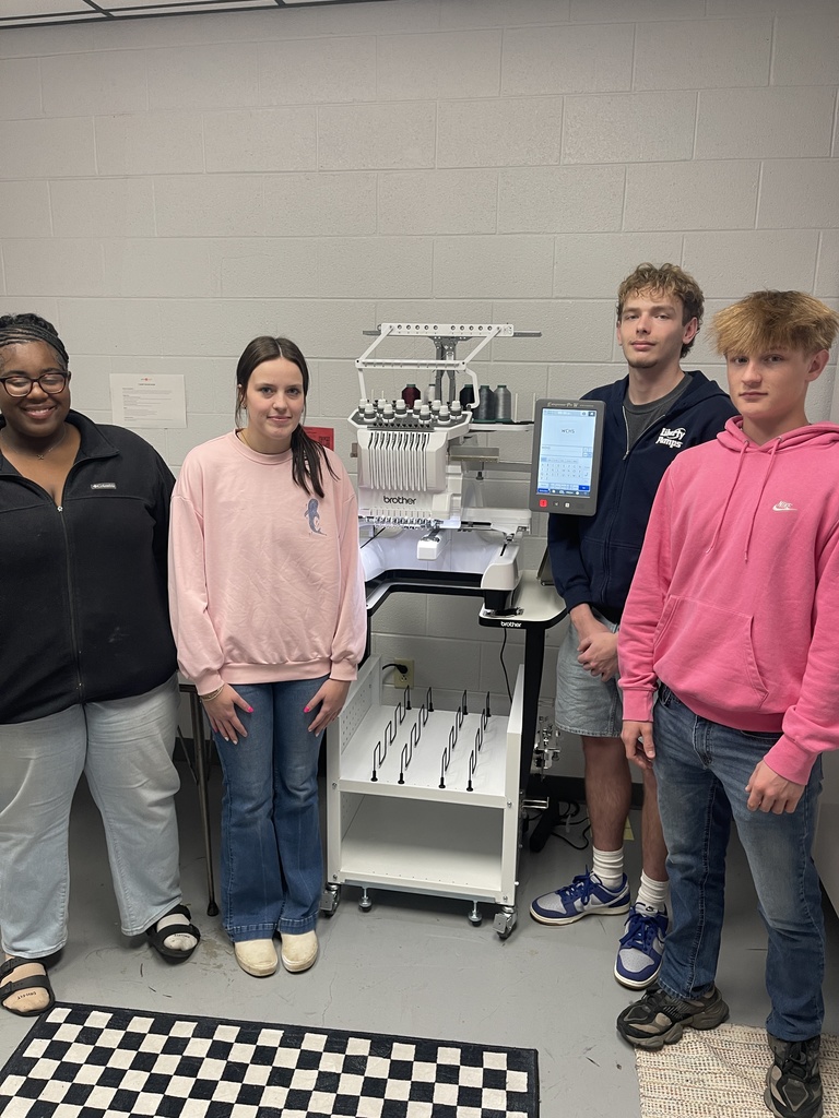 wchs students with new embroidery sewing machine for fbla spirit store project