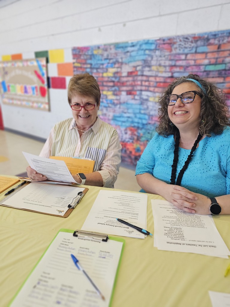 west carroll primary workers welcome new students registering