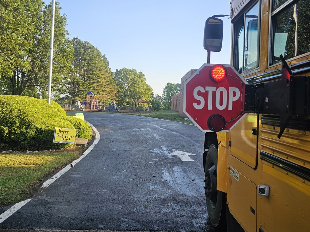 west carroll school bus with stop sign deployed on school driverway