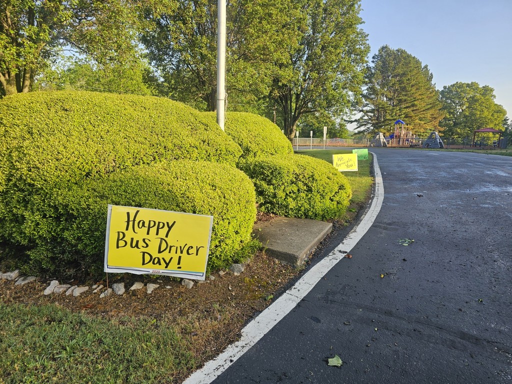 signs appreciating bus drives as they drove in the school driveway