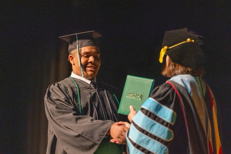 Amaire Kelley receiving diploma