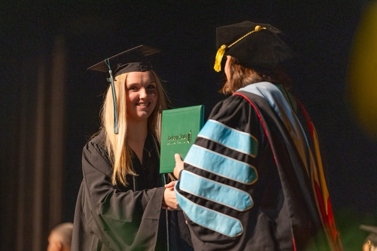 Grace Newsome receiving diploma