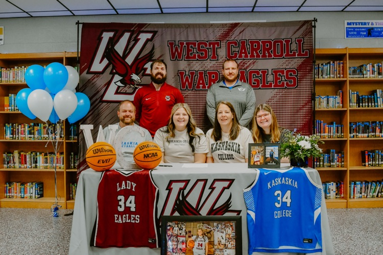 Hailey Mitchell with coaches and family