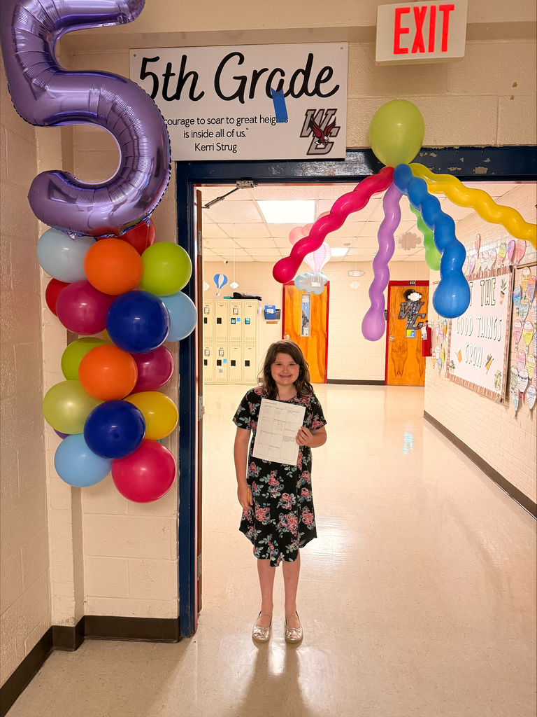 west carroll elementary student as she particpates in Move Up day in decorated hallway